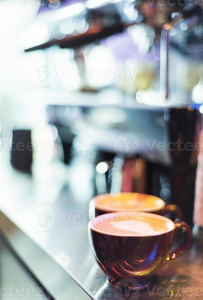 Espresso Expresso italienische Kaffeetasse mit Maschine foto