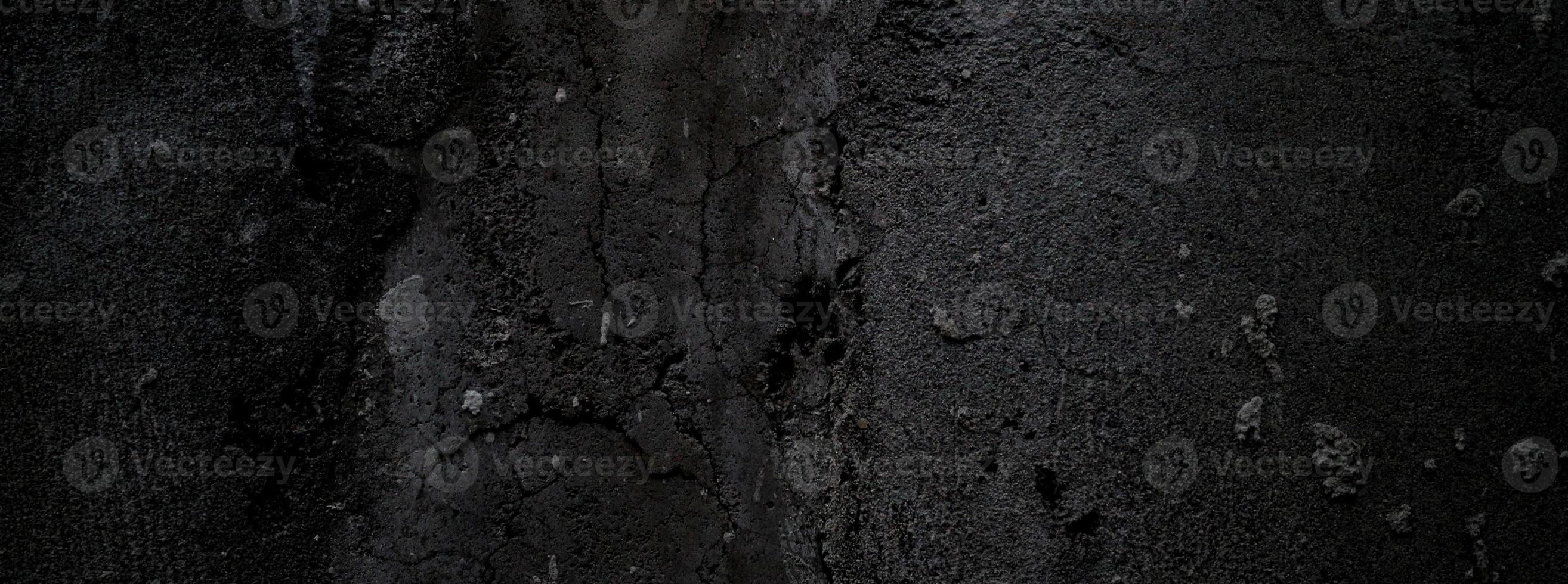 schwarze wand beängstigend oder dunkelgrauer rauer körniger steinbeschaffenheitshintergrund. schwarzer Beton für den Hintergrund. foto
