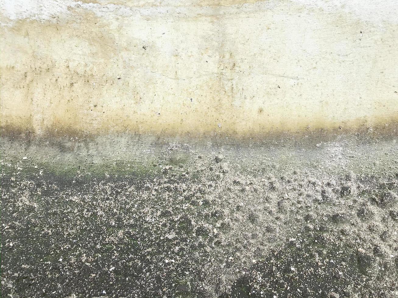 schmutzige Betonwand. alter Oberflächenstrukturhintergrund foto