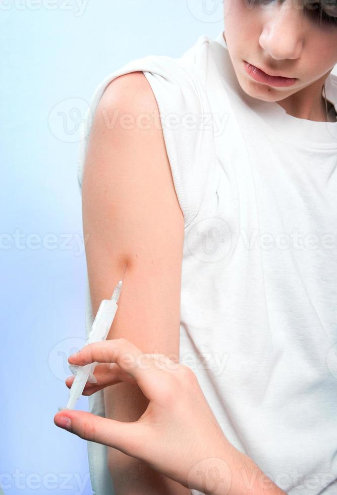 Impfstoff und Junge foto