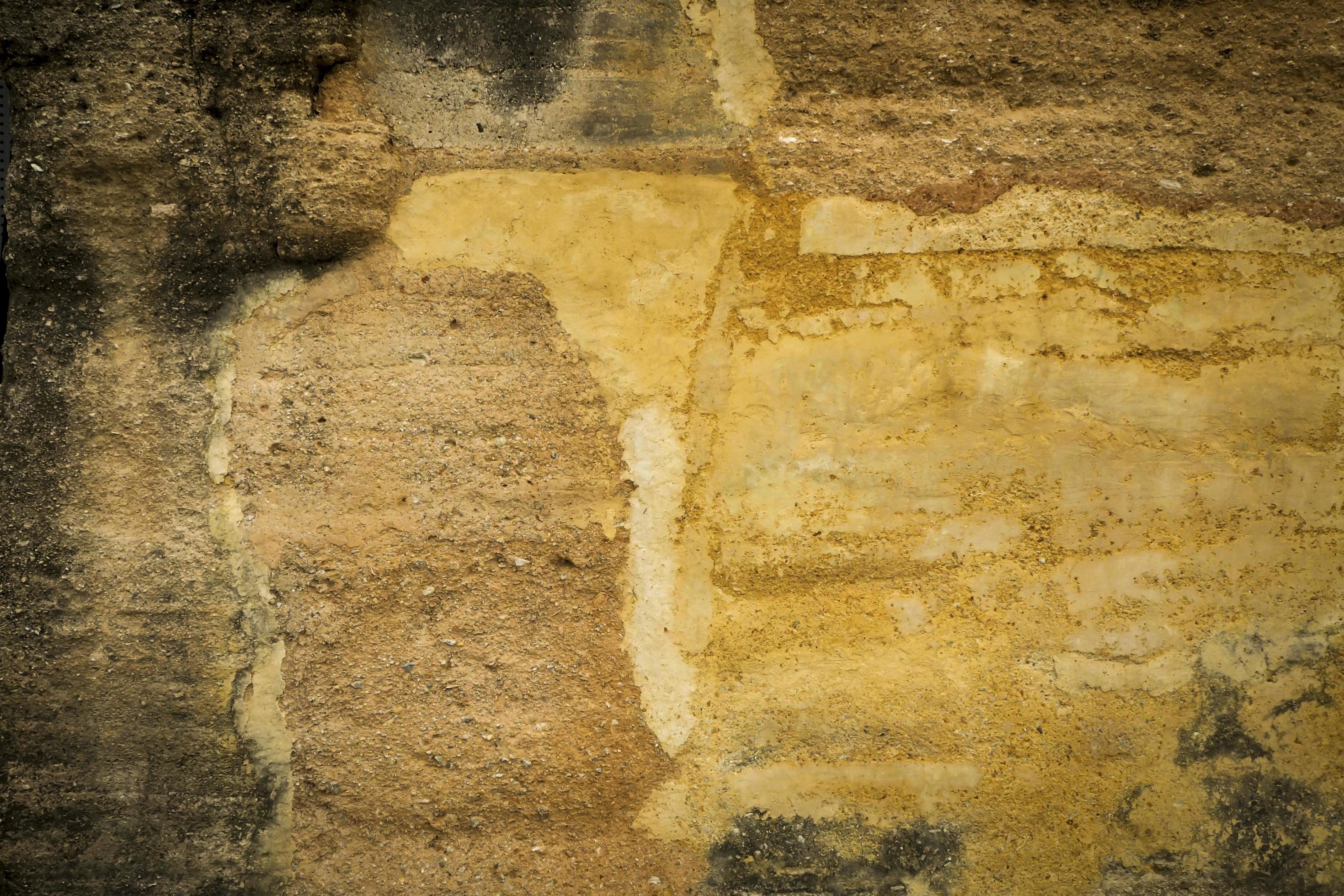 gelbe alte schmutzige Betonwand Textur oder Hintergrund or foto