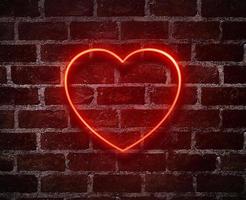 helle herzen neon sign.retro rote backsteinmauer hintergrund hintergrund.happy valentinstag design foto