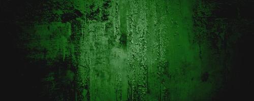 grüne Wand Textur Hintergrund. Halloween-Hintergrund beängstigend. grüner und schwarzer Grunge-Hintergrund mit Kratzern foto
