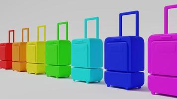 Gepäcktaschen für die Reise, die in den Farben des Regenbogens lackiert sind, stehen in einer Reihe auf weißem Hintergrund. 3D-Darstellung. foto
