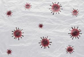 3D-Darstellung eines farbenfrohen, isolierten Corona-Virus, das von Plastikfolie auf weißem Hintergrund bedeckt ist foto