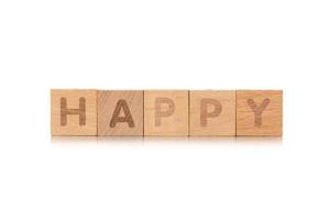 Wort glücklich kleine Holzwürfel mit Buchstaben isoliert auf weißem Hintergrund mit Kopierraum foto