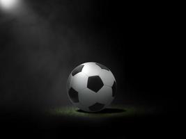 Fußball auf Rasen mit schwarzem Hintergrund foto