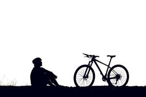 Silhouette einer Person, die Fahrrad fährt foto