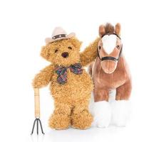 Teddybär-Bauer mit Heugabel und Pferd foto