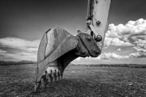 industriellen Hintergrund. Baggerschaufel aus nächster Nähe. Baggerschaufel für den Bau. foto