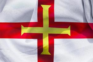 Guernsey-Flagge - realistische wehende Stoffflagge foto