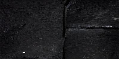 schwarzer schieferwandhintergrund. Tapete aus schwarzem Marmor foto