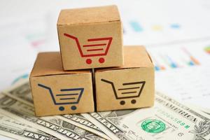 online-shopping, einkaufswagenbox mit geld, import export, finanzhandel. foto