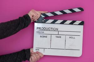 Filmklöppel auf rosa Hintergrund foto