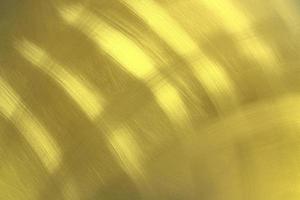 glänzender goldener metallwandbeschaffenheitshintergrund, goldenes muster foto