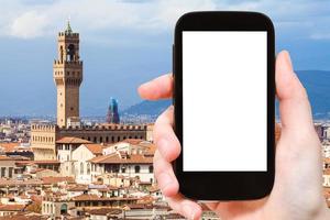 Mann fotografiert Florenz mit dem Palazzo Vecchio foto