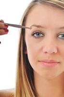 Frau isoliert Augenbrauen-Schönheitsbehandlung foto