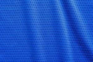 blauer stoff sportbekleidung fußball trikot mit air mesh textur hintergrund foto
