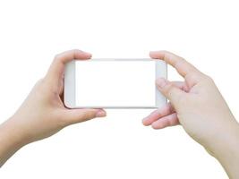 Hand, die ein Smartphone hält, das ein Foto isoliert auf weißem Hintergrund macht
