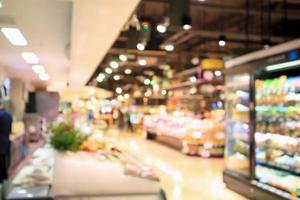 Abstrakter Supermarkt-Lebensmittelladen verschwommener defokussierter Hintergrund mit Bokeh-Licht foto