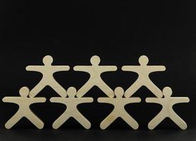 Business-Team-Leute stehen zusammen, zuerst ihr Anführer. Teambuilding-Konzept foto