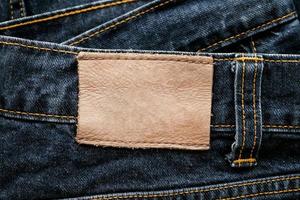 blauer Denim-Jeans-Leder-Label-Textur-Hintergrund foto