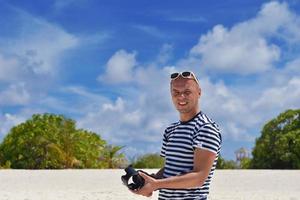 Fotograf fotografiert am Strand foto