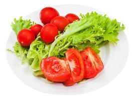 grüner Salat und rote Tomaten foto