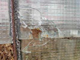 Gewehrkugel zerbrochenes Fensterglas foto