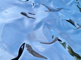 metallischer flüssiger reflexionshintergrund foto