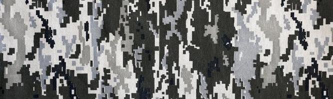 Stoff mit Textur der ukrainischen Militär-Pixeltarnung. Stoff mit Tarnmuster in grauen, braunen und grünen Pixelformen. offizielle uniform der ukrainischen soldaten foto