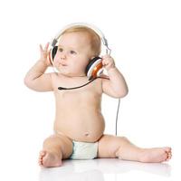 Baby mit Kopfhörer. junger dj foto