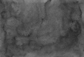 Aquarell schwarze und graue Hintergrundtextur handbemalt. dunkle abstrakte alte monochrome Überlagerung. Tintenflecken auf Papier. foto