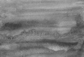 aquarell neutrale graue flüssige hintergrundtextur. einfarbige flecken auf papierhintergrundüberlagerung. abstrakte Schwarz-Weiß-Aquarellmalerei. foto