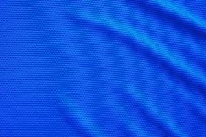 blauer Fußballtrikot Kleidung Stoff Textur Sportbekleidung Hintergrund, Nahaufnahme Draufsicht foto