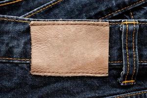 blauer Denim-Jeans-Leder-Label-Textur-Hintergrund foto