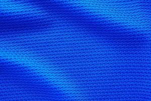 blauer Fußballtrikot Kleidung Stoff Textur Sportbekleidung Hintergrund, Nahaufnahme Draufsicht foto