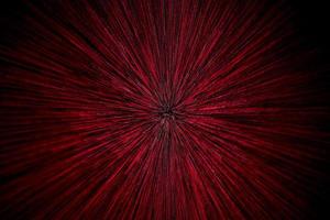 Zoom-Explosion mit natürlicher Linse radial verschwommene rote Partikel auf schwarzem Hintergrund mit selektivem Fokus foto