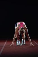 Frau Sprinter Startblöcke verlassen foto