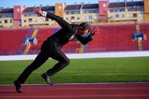 Geschäftsmann bereit zu sprinten foto