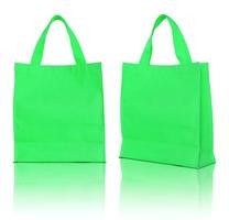 grüne Einkaufstasche auf weißem Hintergrund foto