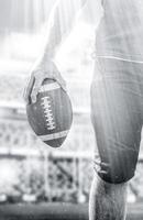 Closeup American Football-Spieler isoliert auf großen modernen Stadion foto