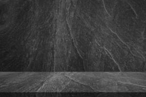 leere schwarze marmortischplatte mit schwarzem steinwandbeschaffenheitshintergrund foto