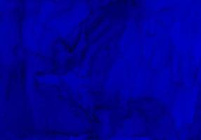 Aquarell dunkelblaue Hintergrundtextur. aquarell abstrakte tiefe ozeankulisse. horizontale trendige Vorlage. Flecken auf Papier. foto