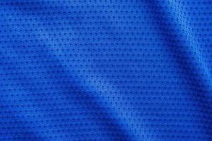 blauer stoff sportbekleidung fußball trikot mit air mesh textur hintergrund foto
