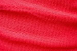 roter sportbekleidungsstoff fußballtrikot trikot textur hintergrund foto