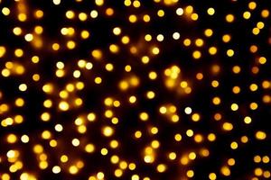 abstrakter unschärfe goldener bokeh heller weihnachtsfeiertagshintergrund foto