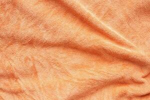 orange handtuch stoff textur oberfläche nah herauf hintergrund foto