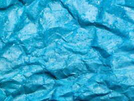 textur des blauen zerknitterten papierhintergrundes für design foto