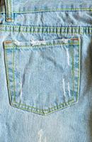 Hintergrund der blauen Denim-Jeans auf der Gesäßtasche foto